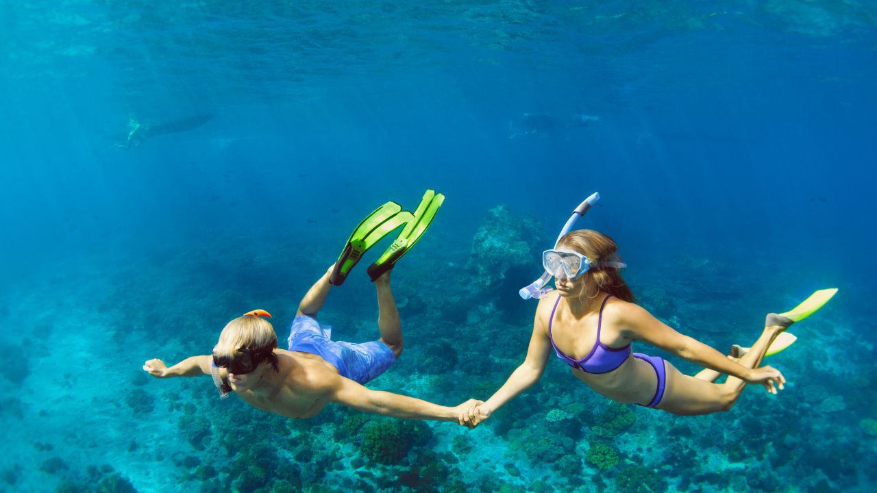 What are the best ways to explore the Maldives’ stunning marine life and coral reefs?
